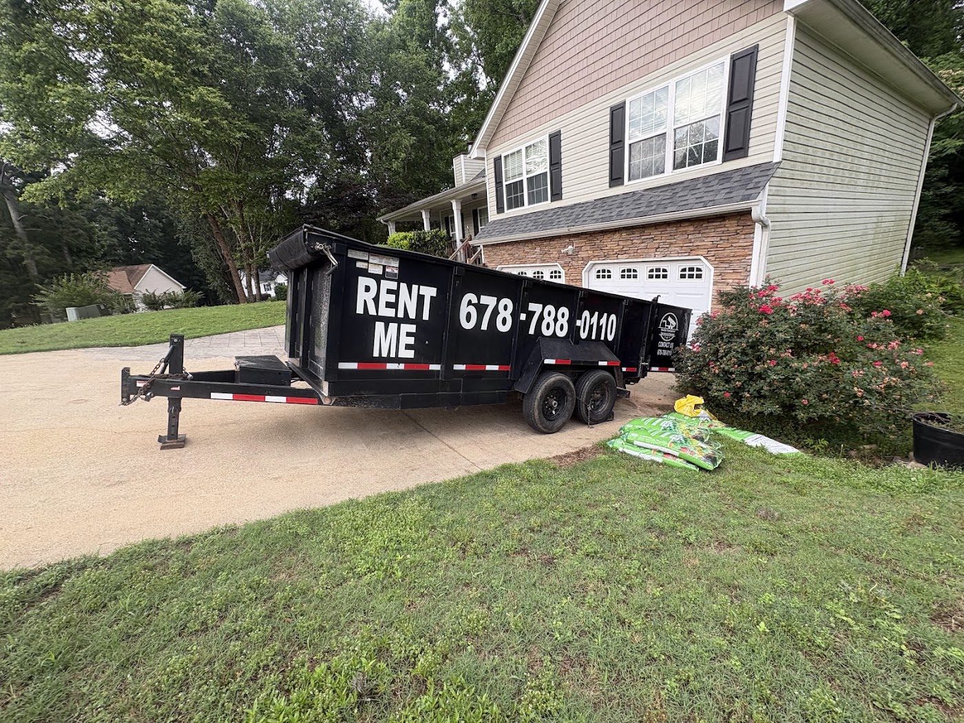 Trailer dumpster at a home